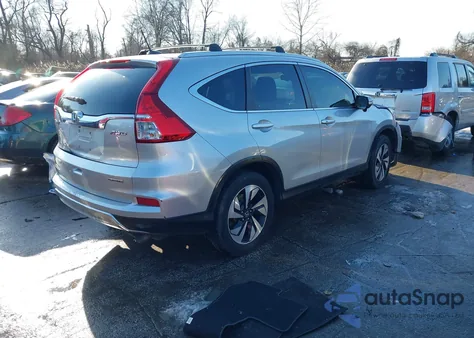 2016 Honda Cr-V Touring z USA, uszkodzony, nr VIN 5J6RM4H91GL067909